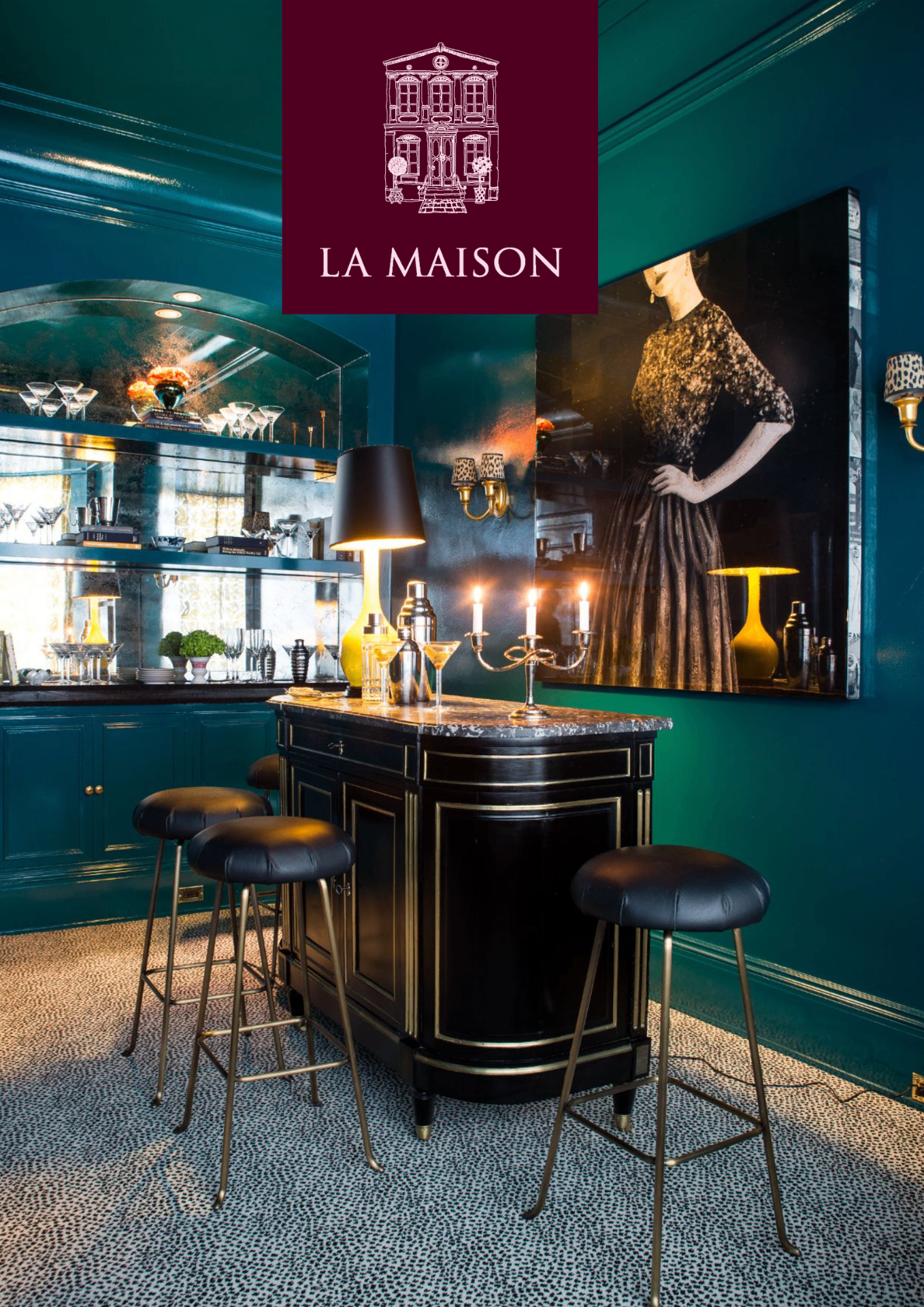 Teal-lacquered bar room at Maison Sainte-Florence with marble-topped island, candelabra, and gilt portrait